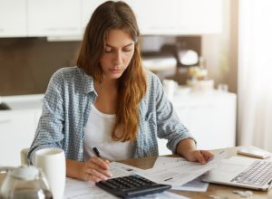 young-woman-checking-her-budget-doing-taxes-scaled_p30114_thumb_resized.jpg